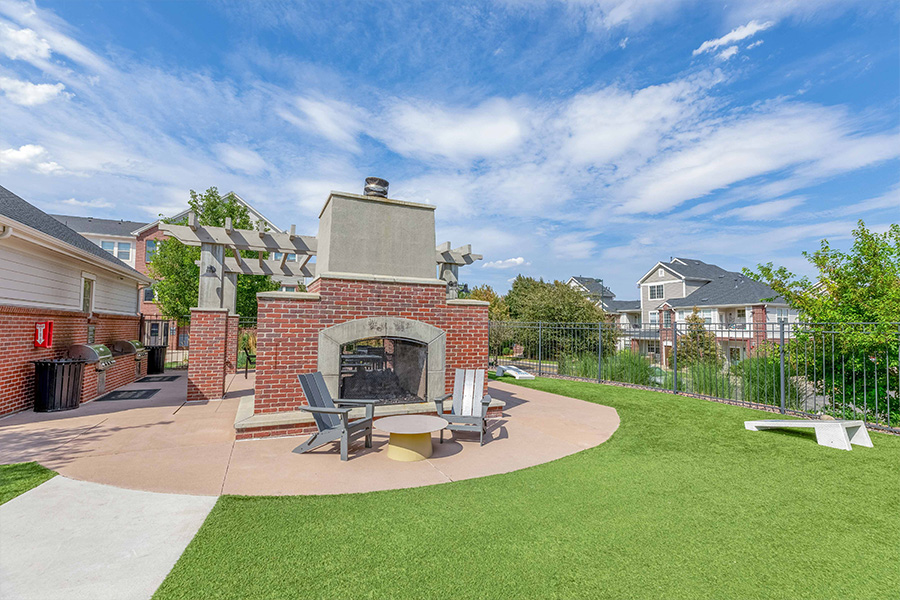 IMT Dayton Station - outdoor fire place with lounge seating and view of community