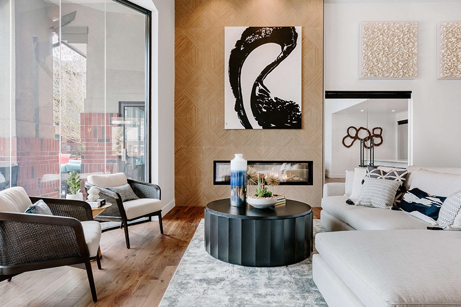 IMT Lowry lounge with wood floor, large rug, built in fireplace, and comfortable furniture.
