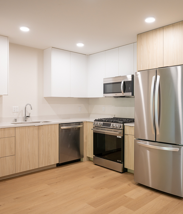 Kitchen photo with fridge, stove, microwave, and dishwasher